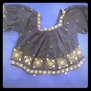 Black crop top with golden accents